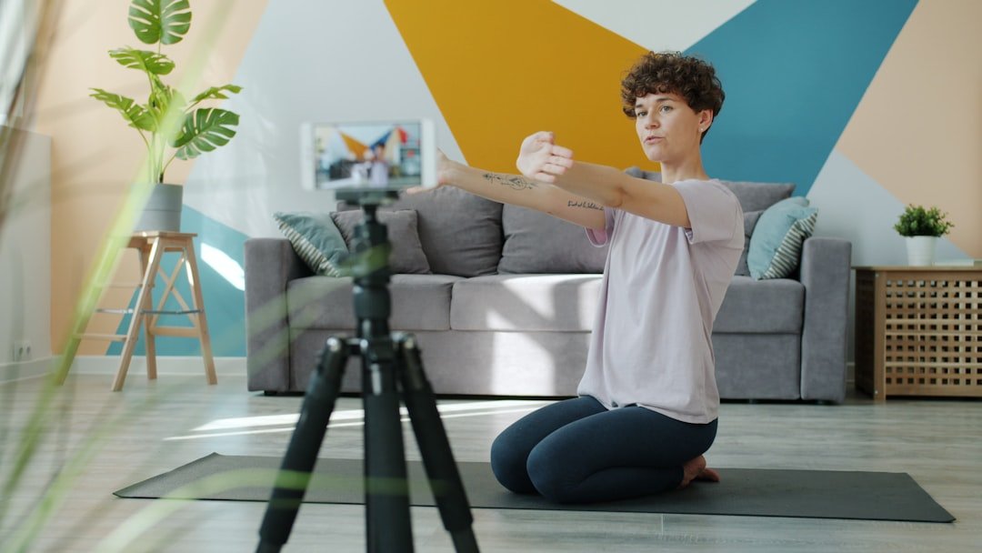 person doing gentle movement on a mat at home